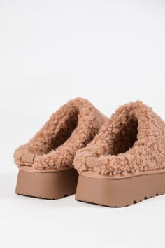 Details Camel Sherpa Platform Slipper Sherpa Heel height: 2" Material and Care Made of man made materials Materials may have natural variations Colors may vary from different viewing devices. If you are returning a pair of shoes: Shoe boxes must be encased in another box for shipping to protect the items. If you send shoes back with stickers and return labels directly on the box, or if the shoe box is damaged, then we will not accept a return. Cocktail Dress Wedding Guest, Holiday Party Fashion, Return Labels, Wedding Guest Style, Red Romper, Shoe Boxes, Green Jumpsuit, Pink Rompers, Blue Romper