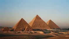 three pyramids are shown in the desert