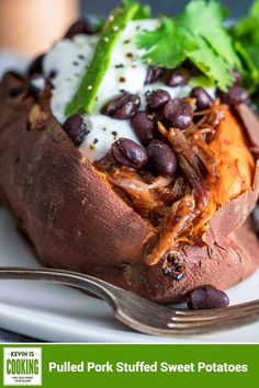 baked sweet potatoes with black beans, sour cream and cilantro on the side