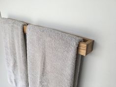 two towels are hanging on a towel rack