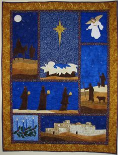 a quilted wall hanging with nativity scenes on it