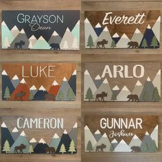 wooden signs with different types of animals and trees on them, hanging from a wall