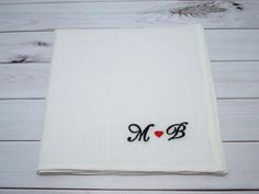 "The term of shipping to the USA is 7-10 days! Personalized embroidered handkerchief is a perfect gift! This handkerchief is made from 100% white linen and measure approximately 12\"x12\" (30cm x 30cm). The letters is about 0.8'' (2 cm). You can choose the color of the letters. The heart is in red color but if you want other color, please contact me. The embroidery is made with Madeira and Gunold embroidery threads (Germany). Also you can change the place of embroidery - please, contact me. All White Monogrammed Handkerchiefs As Gift, White Monogrammed Handkerchiefs For Gift, White Monogram Handkerchiefs As Gift, White Handkerchiefs With Custom Embroidery For Gift, White Handkerchiefs With Custom Embroidery As Gift, Embroidered White Handkerchief Gift, Handmade White Handkerchiefs For Gift, White Embroidered Handkerchiefs As Gift, White Handmade Handkerchief As Gift