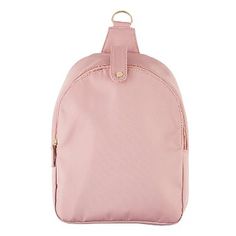 a pink backpack with a zipper on the front and shoulder strap, sitting against a white background