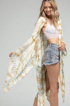 Stunning tie-dye with geometric motif kimono with side slits *100% Viscose *APPROX. L 37" W 41.50" Available Online & In-Store From the #1 Boutique in Oceanside Tie Dye Kimono For Festivals, Spring Tie Dye Kimono With Kimono Sleeves, Festival Tie-dye Kimono With Kimono Sleeves, Tie-dye Kimono With Kimono Sleeves For Festivals, Festival Tie-dye Kimono, Spring Beach Tie Dye Kimono, Spring Beach Tie-dye Kimono, Spring Tie Dye Kimono For Beach, Spring Festival Tie Dye Kimono