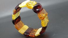 30,5 grams Genuine Big Natural Baltic Amber Bracelet MIX #Unbranded Handmade Rectangular Stretch Bracelet Gift, Elegant Multicolor Rectangular Bracelet, Multicolor Rectangular Bracelets For Gifts, Modern Stretch Bangle Bracelet As Gift, Elegant Multicolor Stretch Bracelet As A Gift, Amber Bracelet, Amber Jewelry, Handmade Wire Jewelry, Baltic Amber