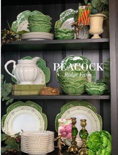 the shelves are filled with green dishes and other decorative items, including cabbage leaves on them