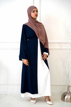 Mix Modest Yet Stylish: Navy Nida Kimono Sleeve Open Abaya The Navy Nida Kimono Sleeve Open Abaya wraps you in comfort and falls to a maxi length for a chic look Maxi Length for a graceful appeal and versatility; comes with a complementary belt for a flattering silhouette Constructed with lightweight fabric for all-day comfort and effortless style Navy color adds elegance and sophistication, perfect for any occasion Pair with your favorite abaya, pants, or top for a timeless & modest style state Abaya Pants, Blue Abaya, Ceremonial Clothing, Abaya Kimono, Hijab Wedding Dress, Pashmina Hijab Tutorial, Open Abaya, Modest Style, Hijab Bride