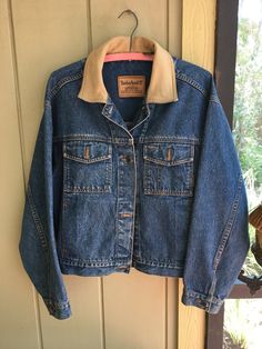 "Vintage Timberland Classic Denim Weathergear Jacket with Leather Trim.  Size L.  Made in Malaysia.  Machine wash cold.  100% indigo cotton with genuine leather trim.  23\" pit to pit; 22\" shoulder to hem;  21\" sleeve.   21\" shoulder to shoulder.  Excellent condition.  (small stain on right sleeve - see pic #4)" Vintage Outerwear With Contrast Stitching For Fall, Washed Denim Jacket For Outdoor, Fall Recycled Denim Outerwear With Pockets, Fall Denim Outerwear With Contrast Stitching, Denim Outerwear With Contrast Stitching For Fall, Fall Denim Blue Outerwear With Contrast Stitching, Casual Denim Jacket With Corduroy Collar, Denim Blue Outerwear With Contrast Stitching For Fall, Classic Denim Jacket With Contrast Stitching