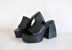 giant platform summer shoes total black platforms 90s shoes size eu 39 uk 6 us 8 vintage japanese sandals women platform slippers ------------------------------------------------------------------------------------ Giant Summer Platforms with heel, only this pair available! Leatherette and Total black / Windsor smith logo on the heel, elastic hold on side, Gaps all over due to storage... see images for details Heel is 11.5 cm ( 4.5 inches) high in the back and 5 cm ( 1.9 inches) in the front sid Japanese Sandals, Black Platforms, 90s Shoes, Windsor Smith, Total Black, Platform Slippers, Black Platform, Sandals Women, Shop Policies