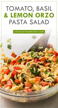 pasta salad with tomatoes, basil and lemon orzo in a glass bowl on a table