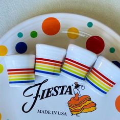 fiesta made in usa plates and napkins on a polka dot plate with colorful dots