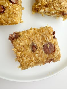 three pieces of granola bars on a white plate