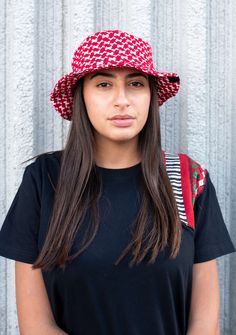 By popular demand, we introduce our keffiyeh bucket hat in red, a must-have accessory, and a trendy way to wear the iconic keffiyeh. It features an all-around keffiyeh print and comes in two different sizes to ensure a perfect fit. Impact By purchasing this item you are providing sustainable employment to refugees in Jordan. Learn more about Karam by KUVRD. Key Features Bucket style Made out of 100% authentic keffiyeh woven keffiyeh Hand Washable, Soft, Breathable Fabric Content: 65% Cotton 35% Red A, Layer Mask, Protect Yourself, Breathable Fabric, Bucket Hat, Must Haves, Face Mask, Filter, Jordan