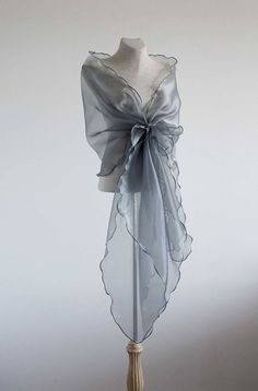 Grey-silver, navy, white, black Organza shawl. Mother of the bride shawl. Shoulder Cover up. Evening wrap. Elegant design evening wrap made with holder flower style. You can look dress up on this shawl even with simple dress. Second picture shows how shawl looks with dress. Shawl has adjustable Evening Shawl Wrap Scarf, Elegant Organza Shawl For Evening, Elegant Evening Shawl Wrap, Evening Shawl Wrap, Elegant Silver Shawl For Formal Occasions, Formal Organza Shawl, Elegant Wedding Wrap, Elegant Silver Shawl For Evening, Wedding Scarf Wrap Shawl