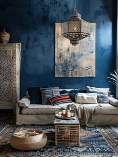 a living room with blue walls and rugs on the floor in front of it