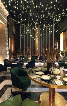 an elegant restaurant with green chairs and lights hanging from the ceiling above it's tables