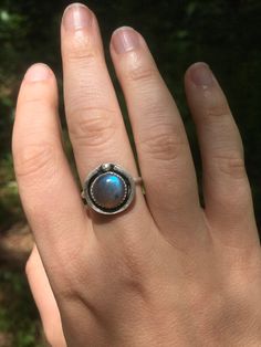 This simple ring is so light and airy, you're sure to receive compliments whenever you wear it. It features a hollowed back plate in order for the stone to be most responsive to light, and loves to throw reflections of light aqua, lilac, and other tiny spectrums of color when it hits the light. This ring is handcrafted from sterling silver and is super comfortable. Adjustable Moonstone Ring For Everyday, Adjustable Silver Moonstone Ring For Everyday Wear, Adjustable Everyday Moonstone Ring, Unique Adjustable Ring With Round Stone, Unique Adjustable Rings With Round Stone, Adjustable Labradorite Moonstone Promise Ring, Minimalist Silver Turquoise Ring, Adjustable Labradorite Rings For Anniversary, Minimalist Large Stone Ring For Anniversary