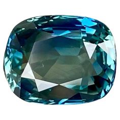 an aqua blue diamond on a white background