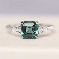 All HANDMADE ITEMS SHIP IN APPROX 8 DAYS Main Stone: Lab created green sapphire Main Stone Size: Asscher cut 7 mm x 7 mm Main Stone Weight: 2.42 carat Side Stone: Pear shaped 3x4 mm CZ Height From The Ring Setting Bottom(to gemstone top): about 5.92 mm Width of Ring band Measure: gradually varied,about 1.30-2.28 mm Material: 925 Sterling Silver/14K White Gold/14K Yellow Gold/14k Rose Gold Engraved: Available For FreeNo more than 13 letters) Customized:Of course! Tell me what you want Includes Wi Green Sapphire Engagement, Green Sapphire Engagement Ring, London Blue Topaz Ring, Gold Engraving, Sapphire Engagement Ring, Asscher Cut, Local Jewelry, Ring Setting, Green Sapphire