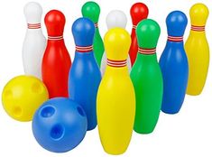 colorful plastic bowling pins and balls on a white background