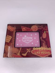 a pink picture frame with las vegas on it