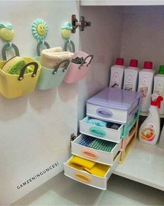 there is a shelf in the bathroom with many items on it and some soaps