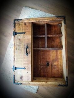 an open wooden box on the floor