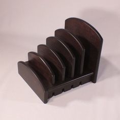 three wooden business card holders sitting on top of each other