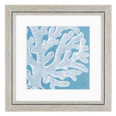 a framed blue and white artwork piece