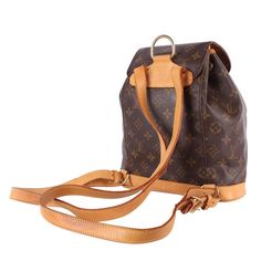 Authentic Louis Vuitton Brown Monogram Montsouris Backpack Mm (Medium size). Features monogram canvas with leather trim, front zippered pouch, top string closure with buckle front flap, the interior has a brown textile lining with slip pocket, adjustable shoulder straps. This bag is perfect for shopping, travel, school, and hands-free needs. Unisex bag! You will love the luxury design of this breathtaking backpack. Authenticity Date Code: SP0917 Made in France Strap Drop: (adjustable) Montsouris Backpack, Pre Owned Louis Vuitton, Leather Formal Shoes, Louis Vuitton Brown, Quality Handbags, Zippered Pouch, Travel School, Shopping Travel, Bag Packaging