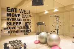 a gym with exercise balls and machines in the background, as well as an advertisement on the wall that says eat well move daily