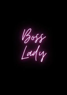 a neon sign that says boss lady in pink on a black background with the words boss lady written below it