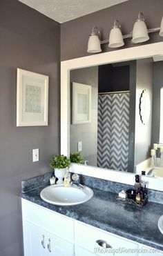 the bathroom is decorated in gray and white