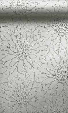 a close up view of a flowered fabric with white and grey flowers on it