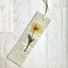 a bookmark with a yellow flower on it