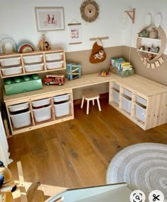 a child's playroom with toys and storage