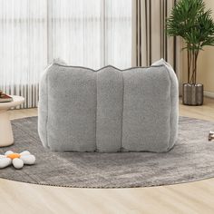 a living room scene with focus on the floor and pillows in the shape of hearts