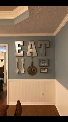 a dining room with blue walls and white trim