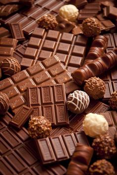 many chocolates are scattered on top of each other