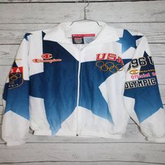 Champion Team USA 1996 Olympics Vintage All Over Print Windbreaker JacketChampion Team USA 1996 Olympics Vintage All Over Print Windbreaker JacketCould you please clarify which specific type of shirt you are referring to? Is it a dress shirt, t-shirt, button-up shirt, etc.? This will help me provide a more accurate and tailored description. Thank you! Vintage White Outerwear With Graphic Print, Throwback Long Sleeve Outerwear With Graphic Print, White 90s Track Jacket With Long Sleeves, 90s Style White Long Sleeve Track Jacket, 90s Style White Cotton Outerwear, 90s White Cotton Outerwear, Vintage White Long Sleeve Track Jacket, Vintage White Cotton Windbreaker, Vintage Fitted Long Sleeve Windbreaker