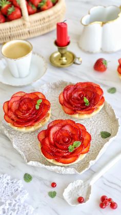 strawberry shortbreads on a plate with strawberries next to it and a basket of strawberries in the background