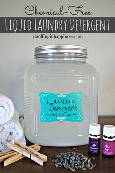 an image of laundry detergents on a table with towels and bottles next to it