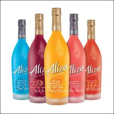 four bottles of wine are lined up in a row on a white background with the words allez alze alze