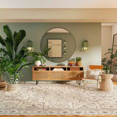 a living room filled with lots of furniture and plants in front of a round mirror