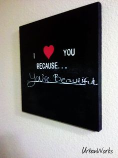 i love you because you're beautiful written on a black canvas mounted to the wall