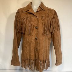 Women’s Fringed Suede Leather Western Cowgirl Jacket. Made By Back In The Saddle. Wonderful Design With Fringes At Top And Bottom Of Jacket. Button Closures And Lined. Women’s Size Small Please See Measurements Armpit To Armpit Approximately 19 Inches Length From Back Below Collar To End Of Fringe Approximately 26 Inches Sleeve Length From Shoulder Seam Approximately 23 1/2 Inches Condition Is Very Good Have Very Minor Wear Please See All Photos Vintage Leather Jacket With Fringe For Winter, Cowgirl Jacket, Vintage Winter Leather Jacket With Fringe, Western Leather Fringe Outerwear, Chic Long-sleeve Leather Jacket With Fringe, Brown Long-sleeve Fringe Outerwear, Western Jacket, Woman Back, Western Cowgirls