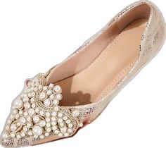 a pair of women's shoes with pearls on them