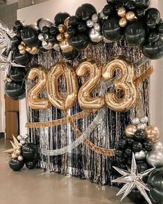 black and gold balloons with the number 205 on them