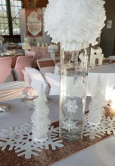 there is a vase with snowflakes on the table